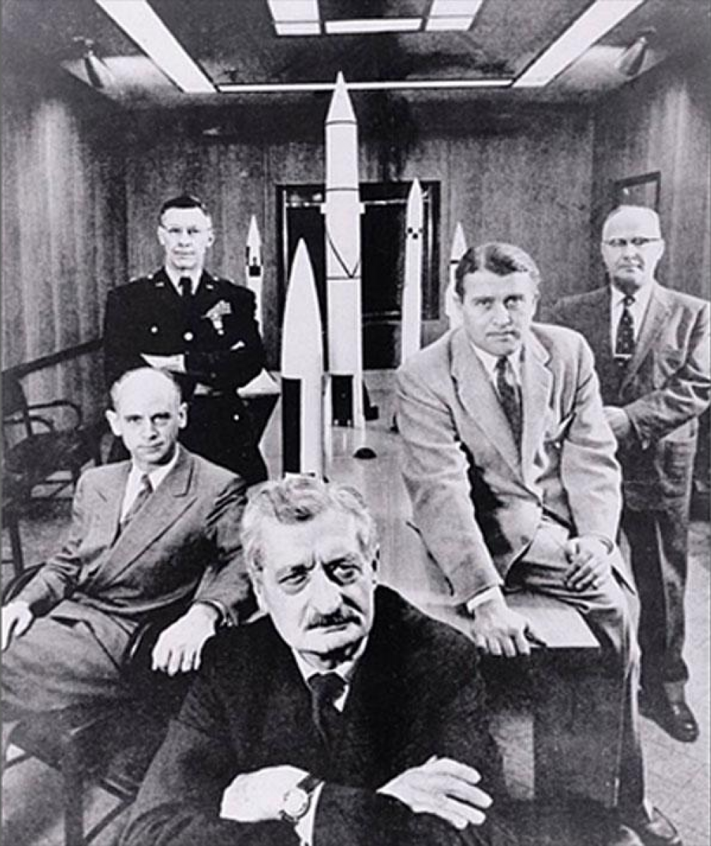 German engineers on the USA space programme, Lusser is on the right hand side, behind Werner
                        von Braun.